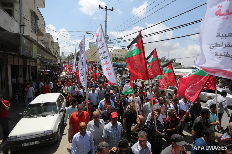 Palestinian demonstrators take part in a protest in support of Palestinian prisoners held in Israeli jails and against the visit of U.S. President Donald Trump, in Gaza City May 23, 2017. Photo by Ashraf Amra