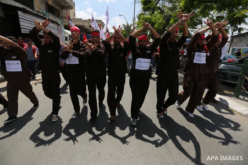 Palestinian demonstrators take part in a protest in support of Palestinian prisoners held in Israeli jails and against the visit of U.S. President Donald Trump, in Gaza City May 23, 2017. Photo by Ashraf Amra