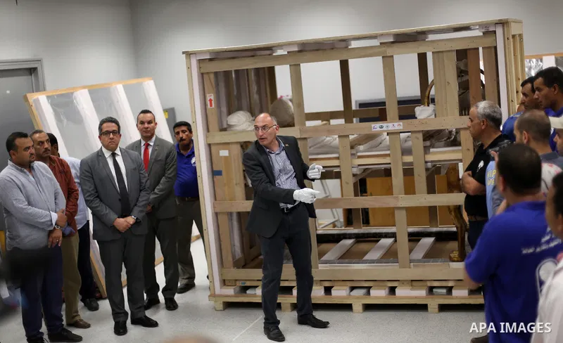 Egyptian workers open a box containing the funerary bed of ancient King Tutankhamun at the Grand Egyptian Museum (GEM) near the Pyramids Plateau in Giza, Egypt on May 23, 2017. The Egyptian Ministry of Antiquities moved...
