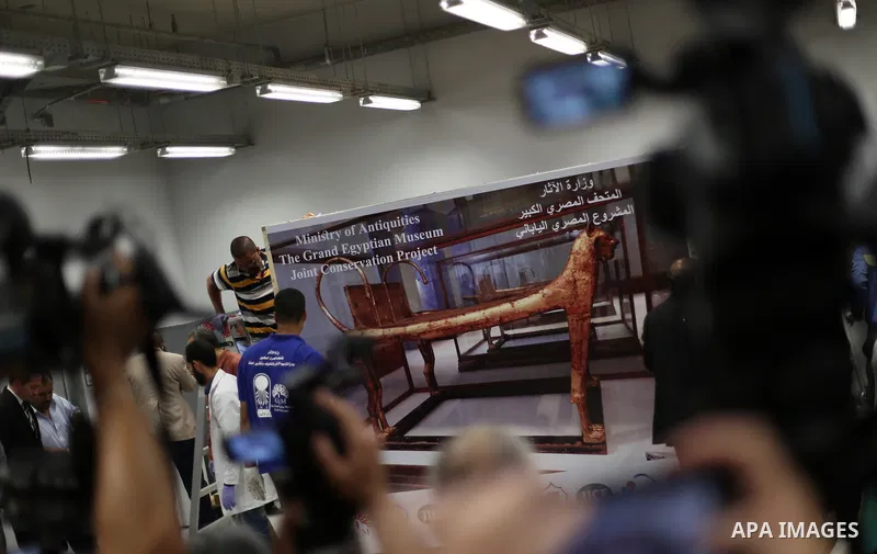 Egyptian workers open a box containing the funerary bed of ancient King Tutankhamun at the Grand Egyptian Museum (GEM) near the Pyramids Plateau in Giza, Egypt on May 23, 2017. The Egyptian Ministry of Antiquities moved...
