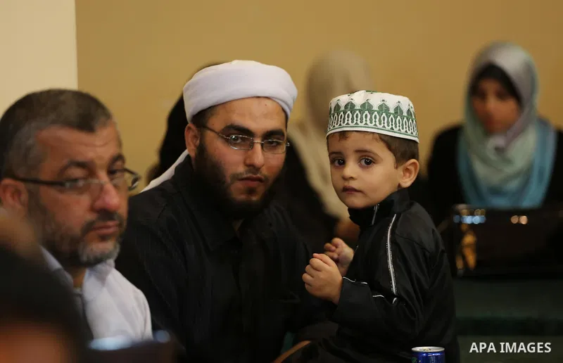 Palestinians attend a ceremony organized by Dar al-Quran and Sunnah, in Gaza city on May 24, 2017. Photo by Mohammed Asad