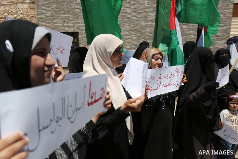 Palestinian women supporter Hamas movement take part during a protest against U.S. President Donald Trump comments linking Hamas with terrorism and support of prisoners refusing food in Israeli jails in Gaza city on May...