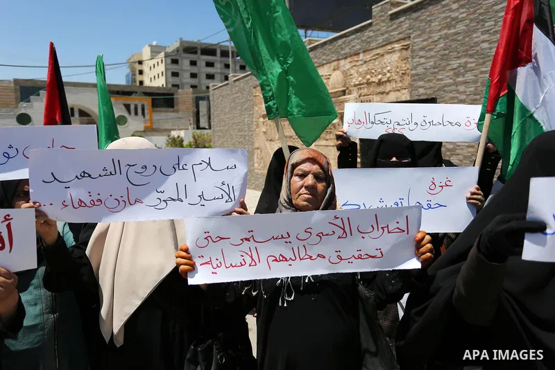 Palestinian women supporter Hamas movement take part during a protest against U.S. President Donald Trump comments linking Hamas with terrorism and support of prisoners refusing food in Israeli jails in Gaza city on May...