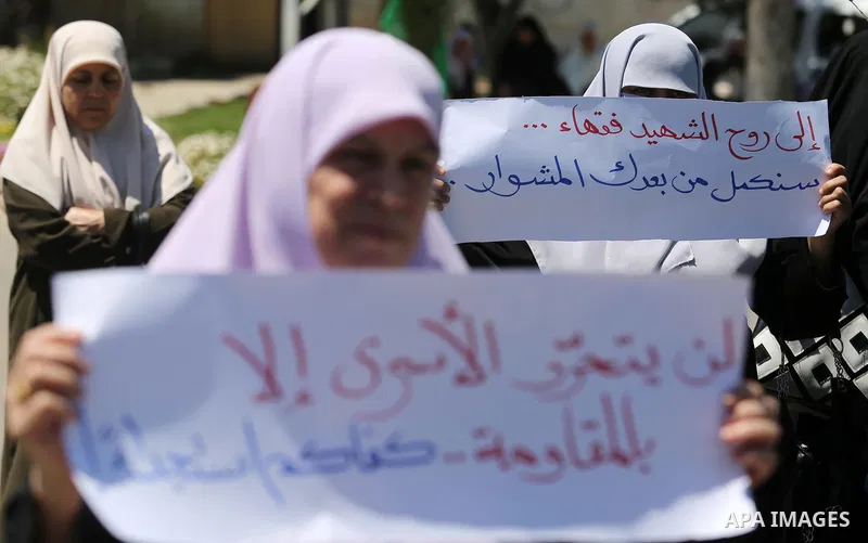 Palestinian women supporter Hamas movement take part during a protest against U.S. President Donald Trump comments linking Hamas with terrorism and support of prisoners refusing food in Israeli jails in Gaza city on May...