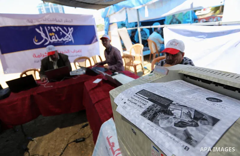 Palestinian Journalists from al-Estqlal newspaper work on printing special edition about Palestinian hunger-striking prisoners held in Israeli jails to solidarity with them at protest tent in Gaza city on May 24, 2017. P...