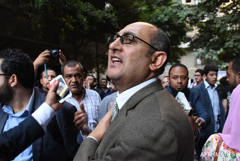 Former Egyptian presidential candidate and rights lawyer Khaled Ali, gestures upon his arrival in Cairo on May 24, 2017, after after he was released on bail. Ali, a former Egyptian presidential candidate and rights lawye...