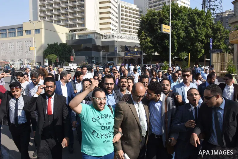 Former Egyptian presidential candidate and rights lawyer Khaled Ali, gestures upon his arrival in Cairo on May 24, 2017, after after he was released on bail. Ali, a former Egyptian presidential candidate and rights lawye...