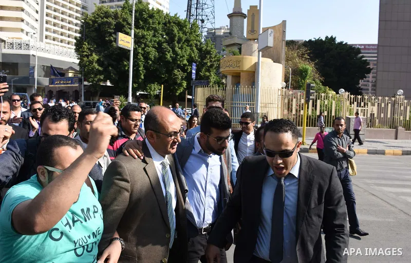 Former Egyptian presidential candidate and rights lawyer Khaled Ali, gestures upon his arrival in Cairo on May 24, 2017, after after he was released on bail. Ali, a former Egyptian presidential candidate and rights lawye...