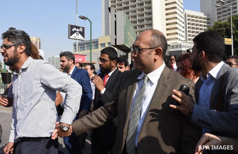 Former Egyptian presidential candidate and rights lawyer Khaled Ali, gestures upon his arrival in Cairo on May 24, 2017, after after he was released on bail. Ali, a former Egyptian presidential candidate and rights lawye...