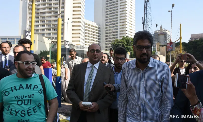 Former Egyptian presidential candidate and rights lawyer Khaled Ali, gestures upon his arrival in Cairo on May 24, 2017, after after he was released on bail. Ali, a former Egyptian presidential candidate and rights lawye...