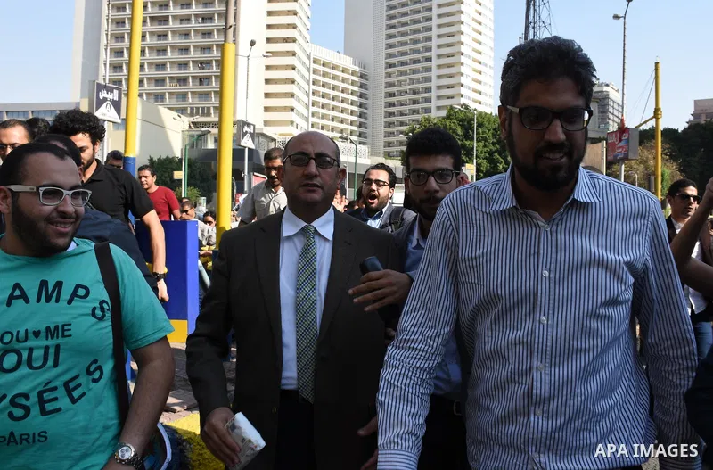 Former Egyptian presidential candidate and rights lawyer Khaled Ali, gestures upon his arrival in Cairo on May 24, 2017, after after he was released on bail. Ali, a former Egyptian presidential candidate and rights lawye...