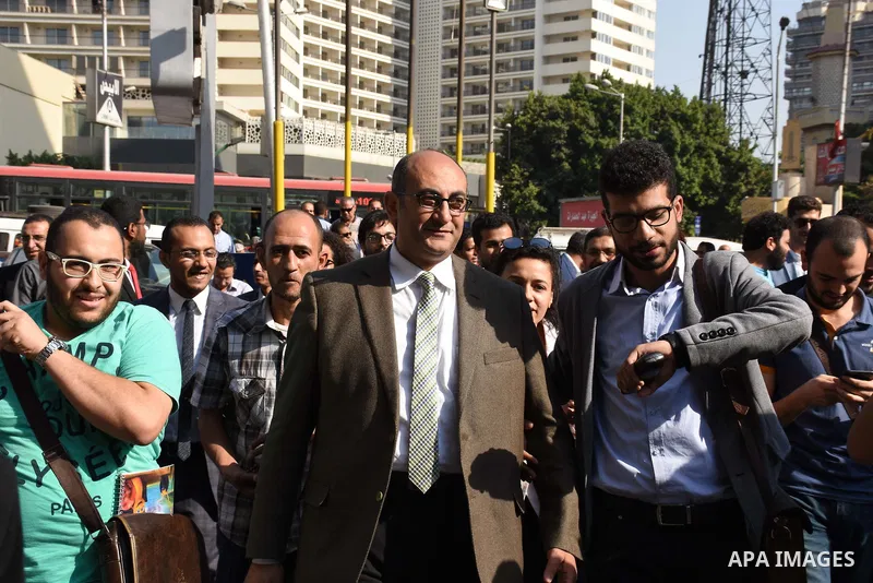 Former Egyptian presidential candidate and rights lawyer Khaled Ali, gestures upon his arrival in Cairo on May 24, 2017, after after he was released on bail. Ali, a former Egyptian presidential candidate and rights lawye...