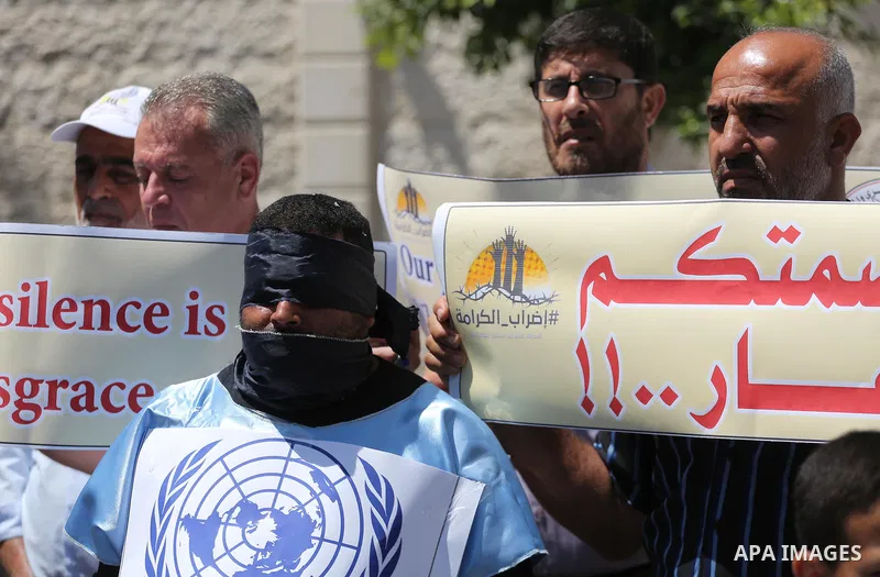Palestinians take part in a protest in support of Palestinian prisoners held in Israeli jails, in Gaza City May 25, 2017. Photo by Mohammed Asad