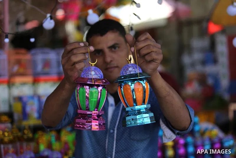 A Palestinian vendor displays traditional lanterns known in Arabic as "Fanous" at a market ahead of the Muslim holy month of Ramadan, in Gaza city, on May 25, 2017 as the faithful prepare to start fasting. Photo by Ashra...