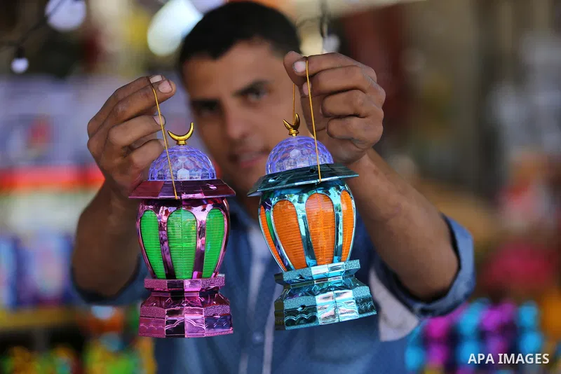 A Palestinian vendor displays traditional lanterns known in Arabic as "Fanous" at a market ahead of the Muslim holy month of Ramadan, in Gaza city, on May 25, 2017 as the faithful prepare to start fasting. Photo by Ashra...
