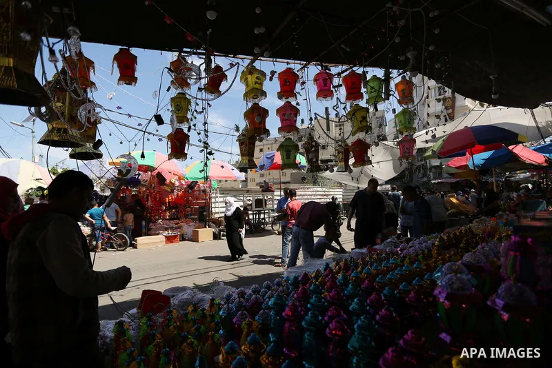 A Palestinian vendor displays traditional lanterns known in Arabic as "Fanous" at a market ahead of the Muslim holy month of Ramadan, in Gaza city, on May 25, 2017 as the faithful prepare to start fasting. Photo by Ashra...