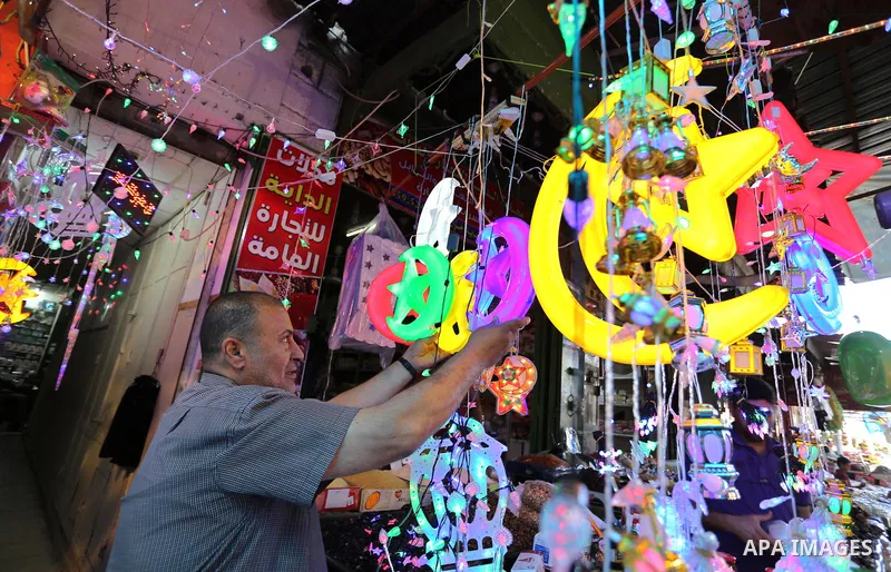 A Palestinian vendor displays traditional lanterns known in Arabic as "Fanous" at a market ahead of the Muslim holy month of Ramadan, in Gaza city, on May 25, 2017 as the faithful prepare to start fasting. Photo by Ashra...