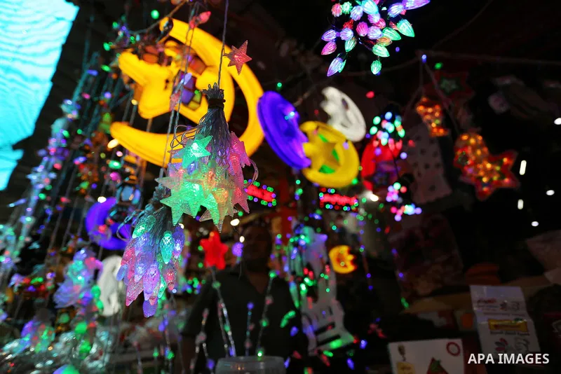 A Palestinian vendor displays traditional lanterns known in Arabic as "Fanous" at a market ahead of the Muslim holy month of Ramadan, in Gaza city, on May 25, 2017 as the faithful prepare to start fasting. Photo by Ashra...