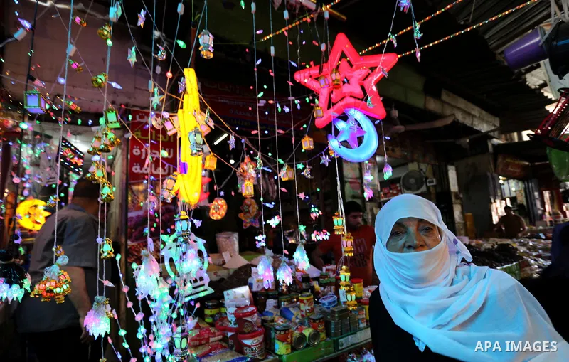 A Palestinian vendor displays traditional lanterns known in Arabic as "Fanous" at a market ahead of the Muslim holy month of Ramadan, in Gaza city, on May 25, 2017 as the faithful prepare to start fasting. Photo by Ashra...