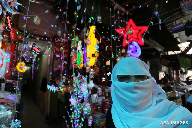 A Palestinian vendor displays traditional lanterns known in Arabic as "Fanous" at a market ahead of the Muslim holy month of Ramadan, in Gaza city, on May 25, 2017 as the faithful prepare to start fasting. Photo by Ashra...