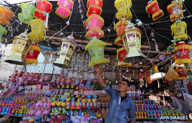 A Palestinian vendor displays traditional lanterns known in Arabic as "Fanous" at a market ahead of the Muslim holy month of Ramadan, in Gaza city, on May 25, 2017 as the faithful prepare to start fasting. Photo by Ashra...