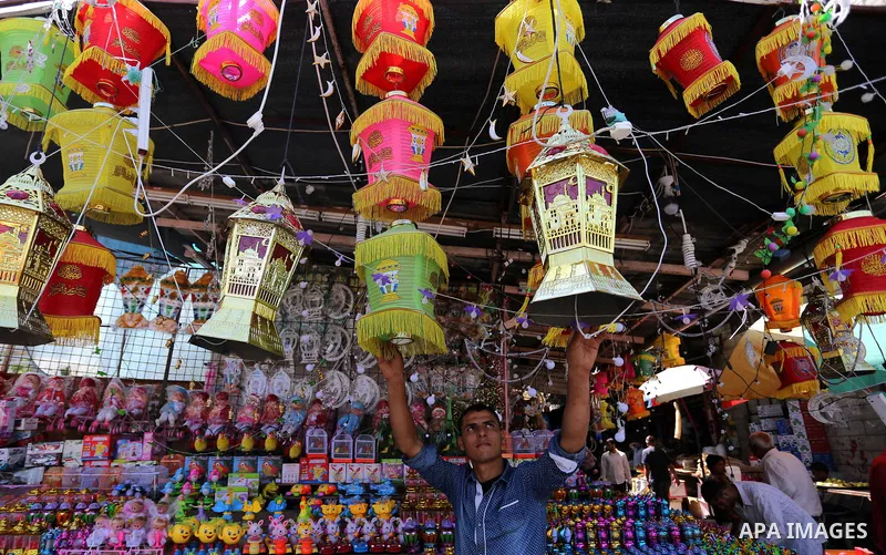 A Palestinian vendor displays traditional lanterns known in Arabic as "Fanous" at a market ahead of the Muslim holy month of Ramadan, in Gaza city, on May 25, 2017 as the faithful prepare to start fasting. Photo by Ashra...