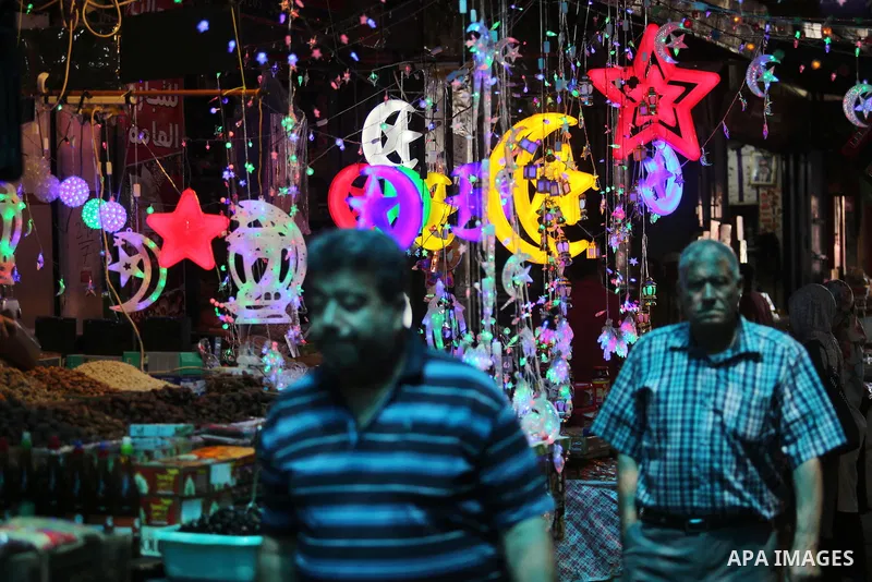 Palestinians shop at a market ahead of the Muslim holy month of Ramadan, in Gaza city, on May 25, 2017 as the faithful prepare to start fasting. Photo by Ashraf Amra