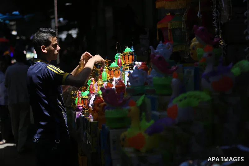 A Palestinian vendor displays traditional lanterns known in Arabic as "Fanous" at a market ahead of the Muslim holy month of Ramadan, in Gaza city, on May 25, 2017 as the faithful prepare to start fasting. Photo by Ashra...