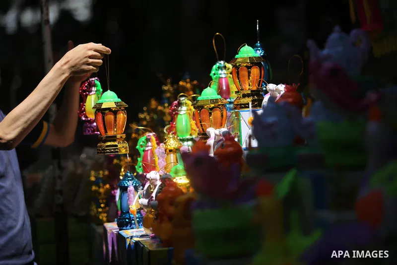 A Palestinian vendor displays traditional lanterns known in Arabic as "Fanous" at a market ahead of the Muslim holy month of Ramadan, in Gaza city, on May 25, 2017 as the faithful prepare to start fasting. Photo by Ashra...