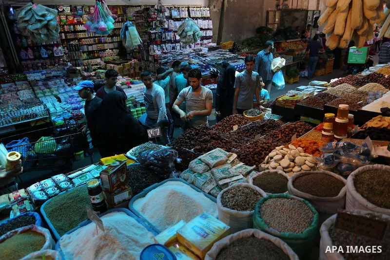 A Palestinian vendor sells pickles at a market ahead of the Muslim holy month of Ramadan, in Gaza city, on May 25, 2017 as the faithful prepare to start fasting. Photo by Ashraf Amra