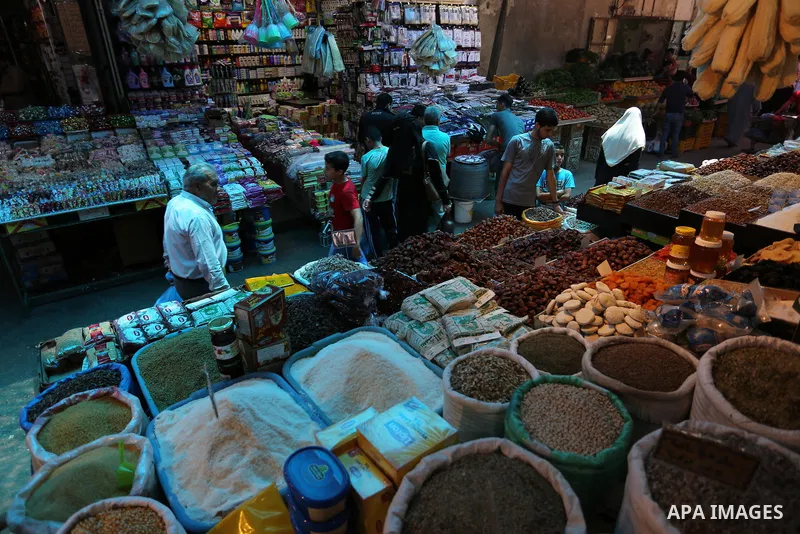 A Palestinian vendor sells pickles at a market ahead of the Muslim holy month of Ramadan, in Gaza city, on May 25, 2017 as the faithful prepare to start fasting. Photo by Ashraf Amra