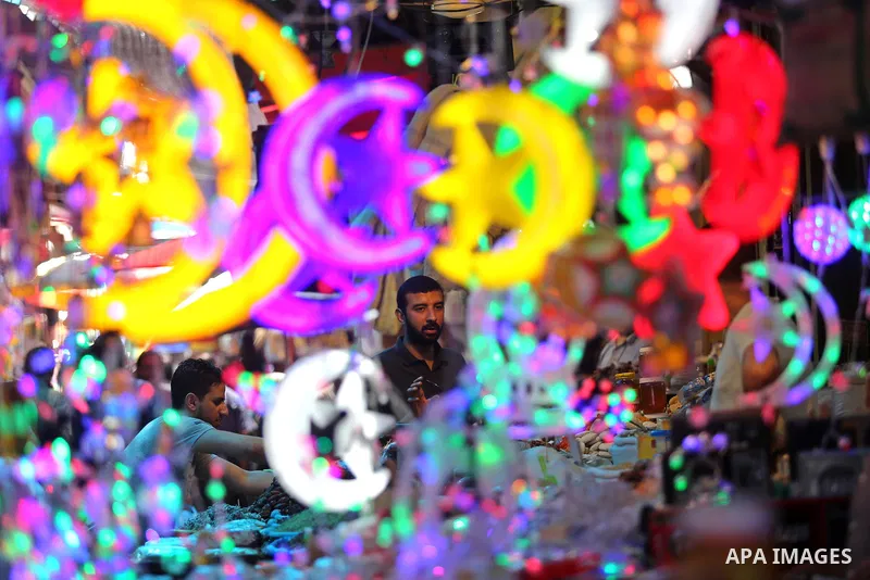 A Palestinian vendor displays traditional lanterns known in Arabic as "Fanous" at a market ahead of the Muslim holy month of Ramadan, in Gaza city, on May 25, 2017 as the faithful prepare to start fasting. Photo by Ashra...