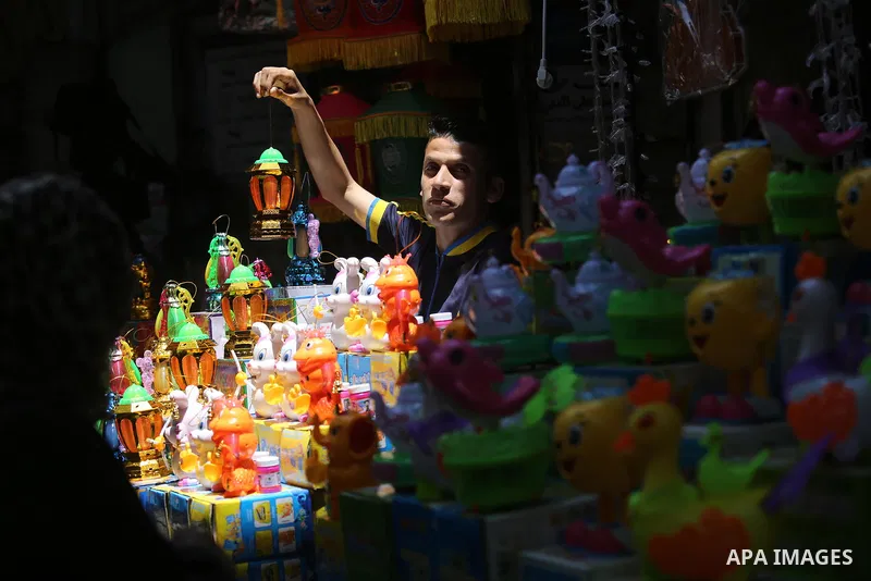 A Palestinian vendor displays traditional lanterns known in Arabic as "Fanous" at a market ahead of the Muslim holy month of Ramadan, in Gaza city, on May 25, 2017 as the faithful prepare to start fasting. Photo by Ashra...