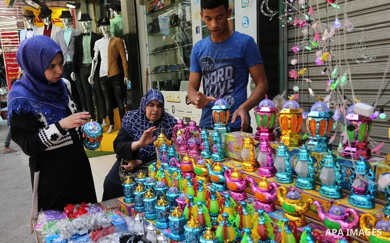 A Palestinian vendor displays traditional lanterns known in Arabic as "Fanous" at a market ahead of the Muslim holy month of Ramadan, in Gaza city, on May 25, 2017 as the faithful prepare to start fasting. Photo by Ashra...