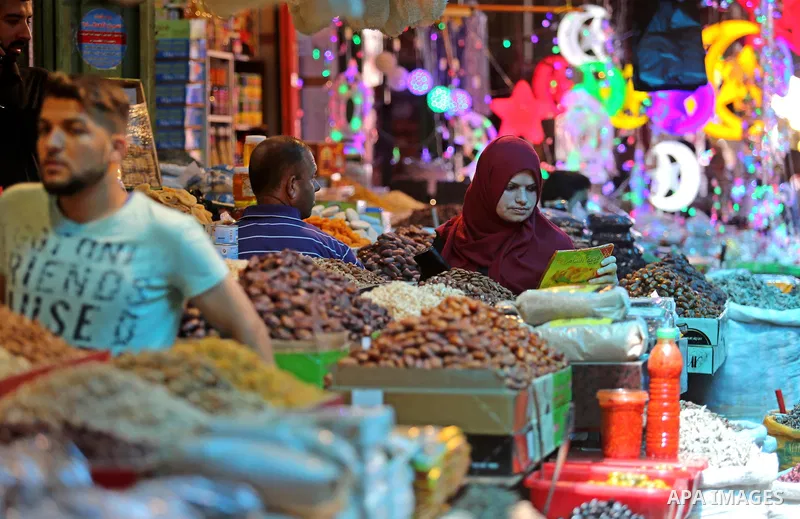 Palestinians shop at a market ahead of the Muslim holy month of Ramadan, in Gaza city, on May 25, 2017 as the faithful prepare to start fasting. Photo by Ashraf Amra