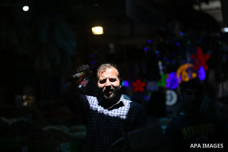 A Palestinian vendor displays traditional lanterns known in Arabic as "Fanous" at a market ahead of the Muslim holy month of Ramadan, in Gaza city, on May 25, 2017 as the faithful prepare to start fasting. Photo by Ashra...