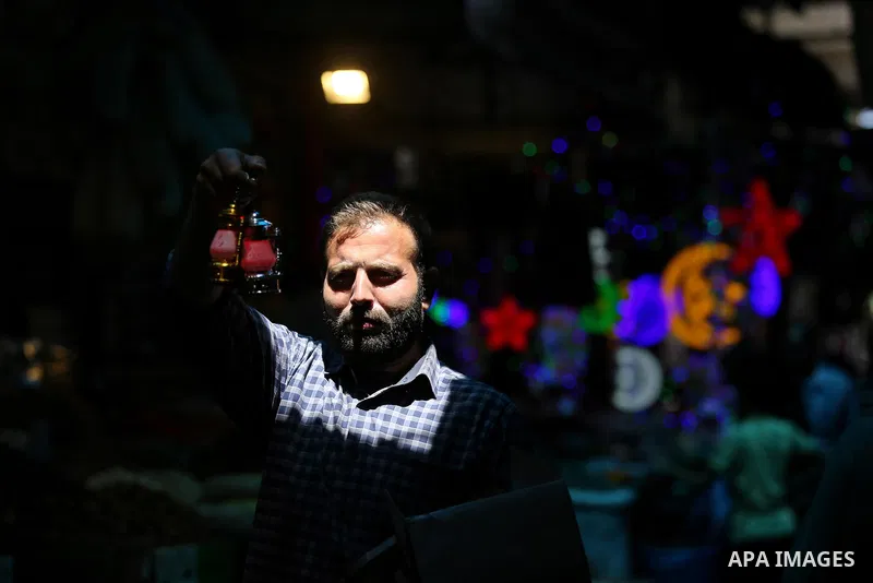 A Palestinian vendor displays traditional lanterns known in Arabic as "Fanous" at a market ahead of the Muslim holy month of Ramadan, in Gaza city, on May 25, 2017 as the faithful prepare to start fasting. Photo by Ashra...