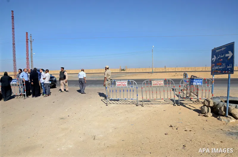 Egyptian policemen stand guard at the entrance of a road leading to Saint Samuel monastery in Minya province, some 260 kms south of the capital Cairo, on May 26, 2017. Masked gunmen attacked a bus carrying Coptic Christi...
