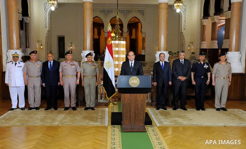 Egyptian President Abdel Fattah al-Sisi gives an address after the gunmen attack in Minya, accompanied by leaders of the Supreme Council of the Armed Forces and the Supreme Council for Police, at the Ittihadiya president...