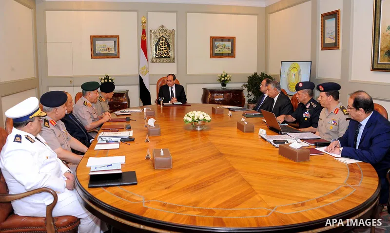 Egyptian President Abdel Fattah al-Sisi meets with leaders of the Supreme Council of the Armed Forces and the Supreme Council for Police after the gunmen attack in Minya, at the Ittihadiya presidential palace in Cairo, E...