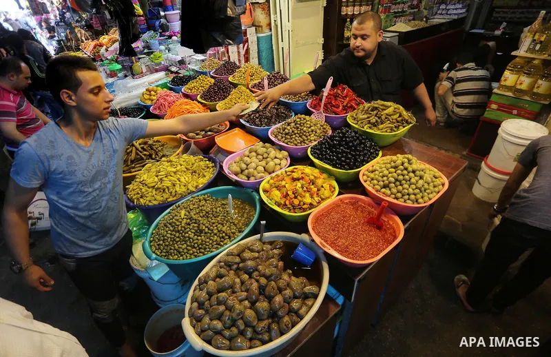 A Palestinian vendor sells dates and pickles on the holy month of Ramadan at market in Gaza city on May 27, 2017. Ramadan is sacred to Muslims because it is during that month that tradition says the Koran was revealed to...