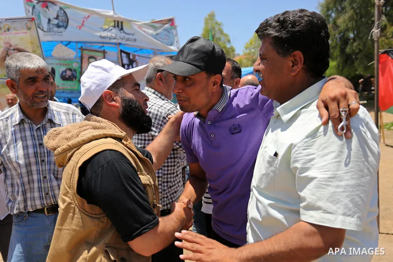 Palestinians celebrate after Palestinian prisoners in Israeli jails suspend hunger strike, in Gaza city on May 27, 2017. Hundreds of Palestinian prisoners on Saturday ended a 40-day hunger strike over conditions in Israe...