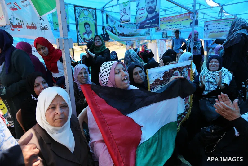Palestinians celebrate after Palestinian prisoners in Israeli jails suspend hunger strike, in Gaza city on May 27, 2017. Hundreds of Palestinian prisoners on Saturday ended a 40-day hunger strike over conditions in Israe...