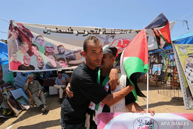 Palestinians celebrate after Palestinian prisoners in Israeli jails suspend hunger strike, in Gaza city on May 27, 2017. Hundreds of Palestinian prisoners on Saturday ended a 40-day hunger strike over conditions in Israe...