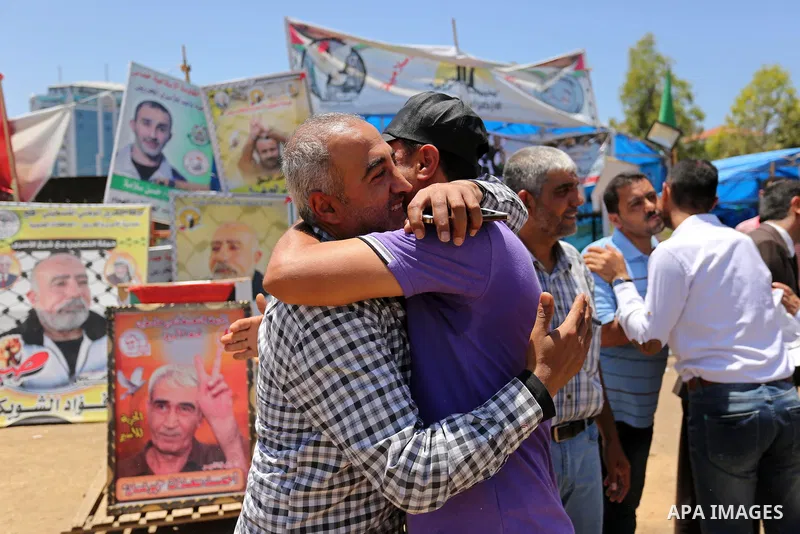 Palestinians celebrate after Palestinian prisoners in Israeli jails suspend hunger strike, in Gaza city on May 27, 2017. Hundreds of Palestinian prisoners on Saturday ended a 40-day hunger strike over conditions in Israe...