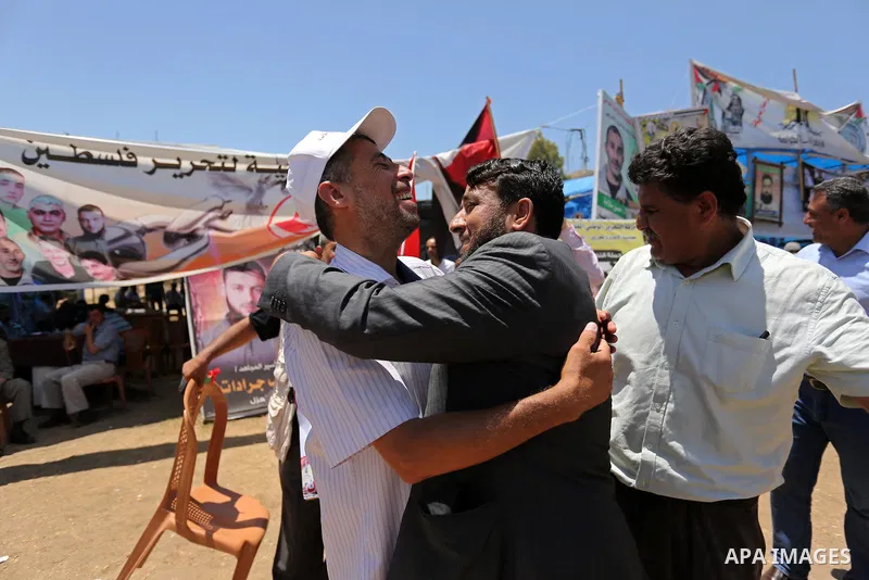 Palestinians celebrate after Palestinian prisoners in Israeli jails suspend hunger strike, in Gaza city on May 27, 2017. Hundreds of Palestinian prisoners on Saturday ended a 40-day hunger strike over conditions in Israe...