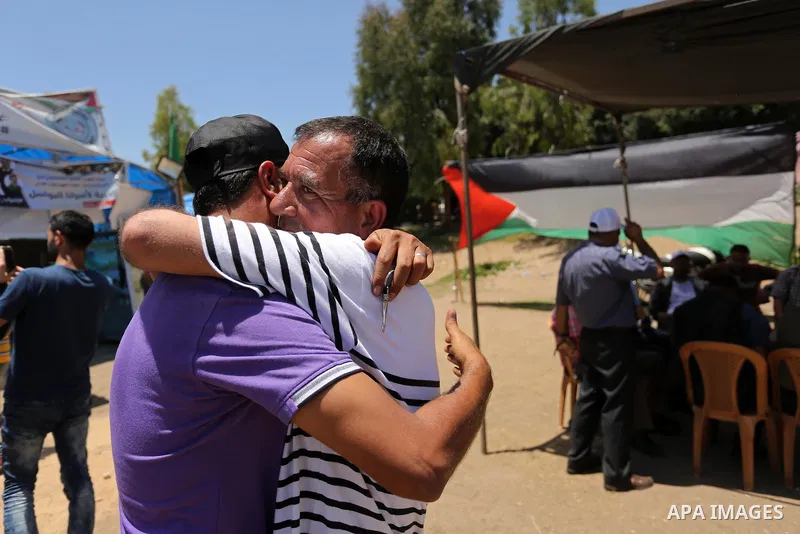 Palestinians celebrate after Palestinian prisoners in Israeli jails suspend hunger strike, in Gaza city on May 27, 2017. Hundreds of Palestinian prisoners on Saturday ended a 40-day hunger strike over conditions in Israe...