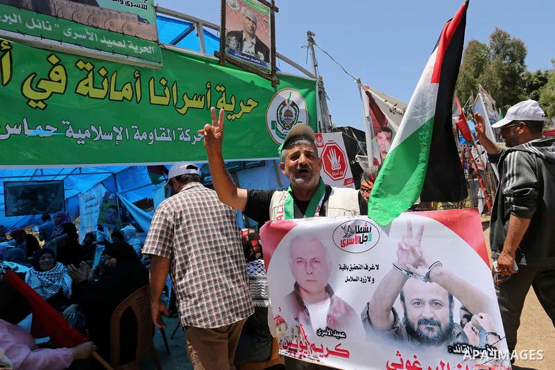 Palestinians celebrate after Palestinian prisoners in Israeli jails suspend hunger strike, in Gaza city on May 27, 2017. Hundreds of Palestinian prisoners on Saturday ended a 40-day hunger strike over conditions in Israe...