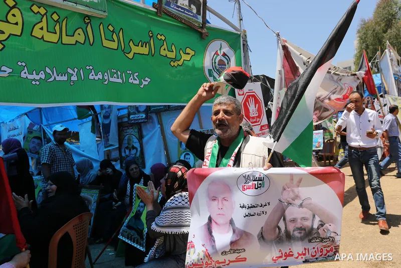 Palestinians celebrate after Palestinian prisoners in Israeli jails suspend hunger strike, in Gaza city on May 27, 2017. Hundreds of Palestinian prisoners on Saturday ended a 40-day hunger strike over conditions in Israe...