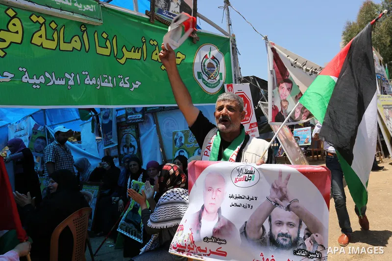 Palestinians celebrate after Palestinian prisoners in Israeli jails suspend hunger strike, in Gaza city on May 27, 2017. Hundreds of Palestinian prisoners on Saturday ended a 40-day hunger strike over conditions in Israe...